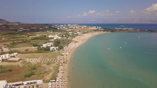Rising establishing shot of Golden Beach on the greek island of Paros; aerial drone tilt; Aegean Sea