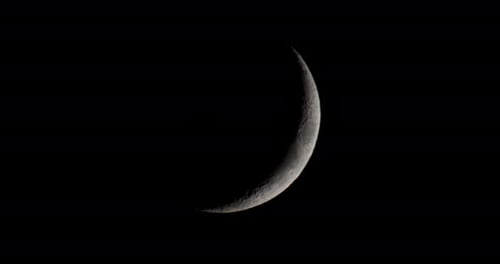 Crescent Moon Shines in the Dark Night Sky