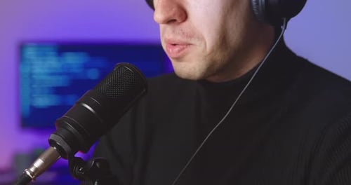 Man Recording Audio Podcast with Microphone at Home