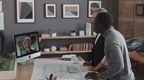 Architects Discussing Blueprints on Video Call