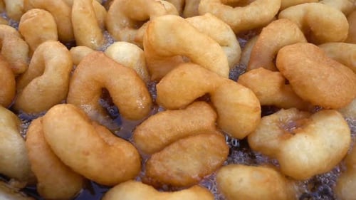 Bubbling Golden Dough Frying in Hot Oil