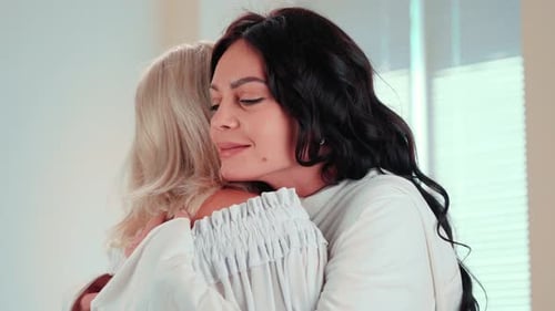 Mature Mom and Young Daughter Hugging