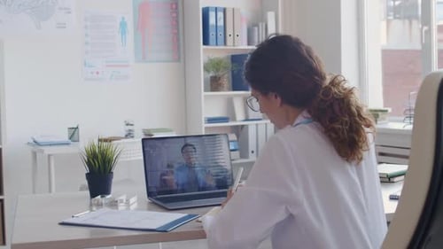 Doctor Discussing Patient During a Telemedicine Appointment