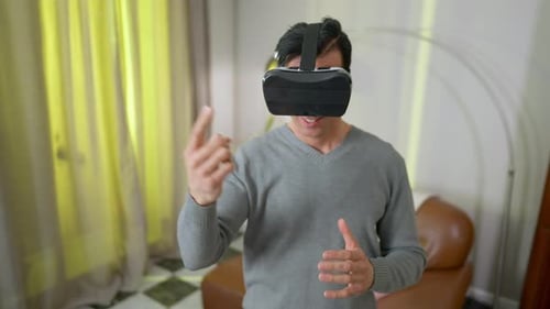 Man Using Virtual Reality Headset Indoors