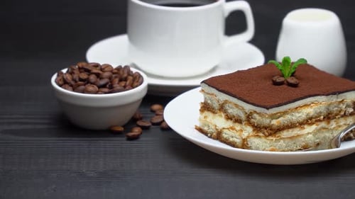 Tiramisu with Coffee on a Dark Wooden Table