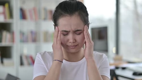 Portrait of Stressed Young Asian Woman Having Headache