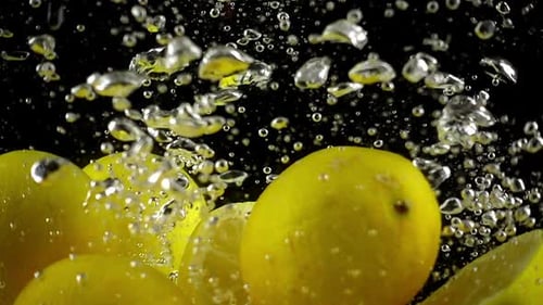 Lemons Dropping and Bubbling Under Water