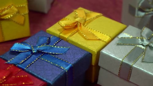 Pile of Colorful Gift Boxes with Ribbons