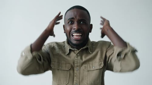 Angry Man Yelling and Gesturing in Studio