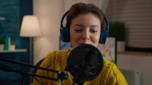 Young Adult Woman Recording Podcast at Home