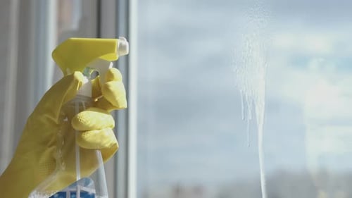 Washing windows close up.