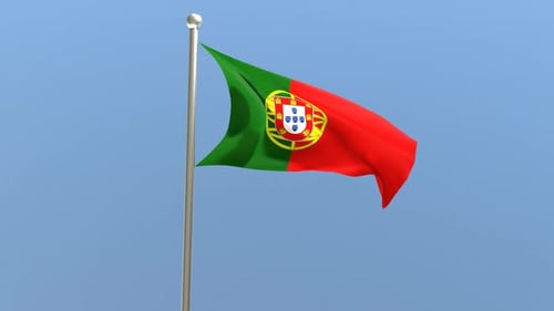 Portugal Flag Waving on Pole Against Blue Sky