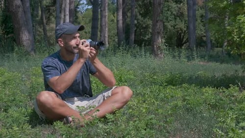 Man take photo in park.