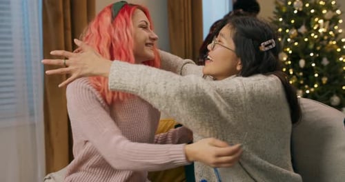 Friends Exchanging Gifts at Christmas Indoors