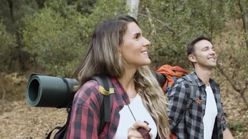 Happy Couple Hiking and Trekking in Wilderness