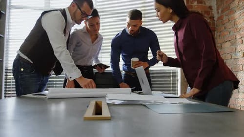 Colleagues Discussing Plans in Office Workplace
