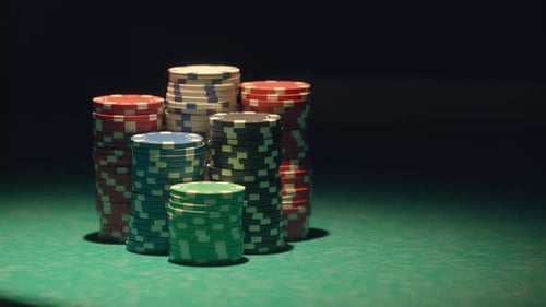Croupier Moves Chips On Table At Casino.