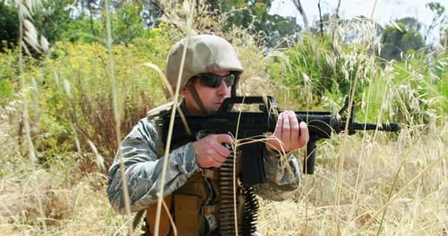 Soldier Kneeling with Rifle in Tall Grass
