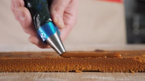 Filling Cake with Pastry Bag Close Up