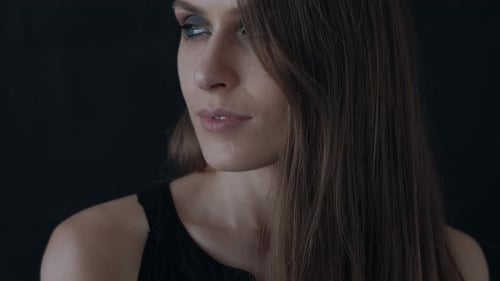 Portrait of a Beautiful Woman on a Black Background