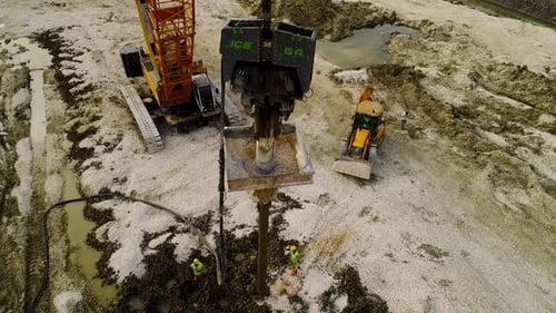 Aerial View of Construction Site with Heavy Machinery