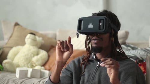 Man Using Virtual Reality Headset at Home