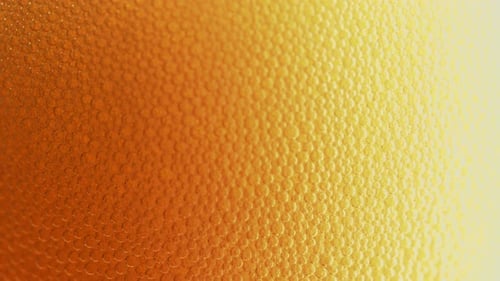 Macro Shot of Bubbles on Amber Liquid