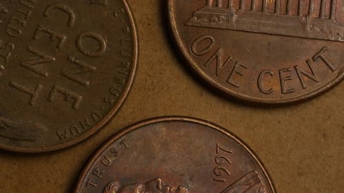 Rotating stock footage shot of American pennies (coin - $0.01) - MONEY 0163