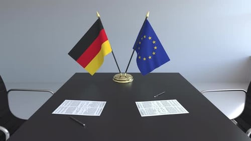 German and European Union Flags on Conference Table