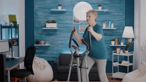Woman Using Elliptical Machine for Fitness at Home