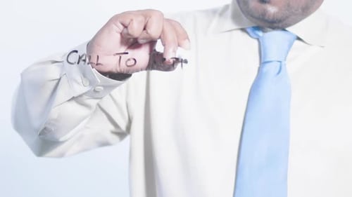 Man Writing Call to Action on Glass