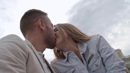 Close Up of Couple Kissing in City