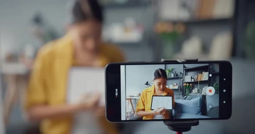 Asia lady teacher video call on smartphone talk by webcam learn teach in online chat at home.