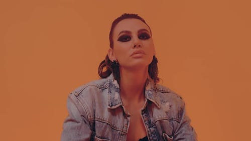 Beautiful Brunette with Dark Makeup Posing