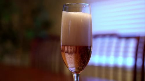 Pouring Champagne In a Glass Flute Close Up
