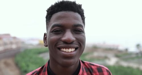 Smiling Young Man Close Up Portrait in City