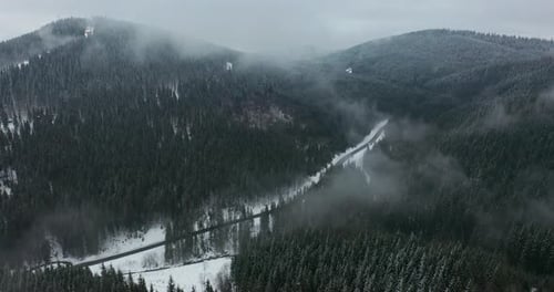 Aerial View. Scenic Mountain Landscape on a Winter Day, Fog in the Low Areas.