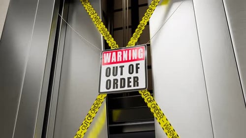 Out of order warning sign in front of a broken elevator door opened. 4KHD