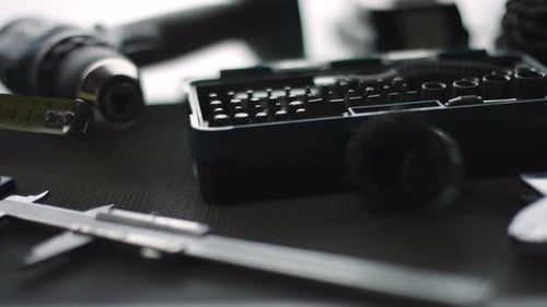 Collection of Assorted Tools on a Dark Surface