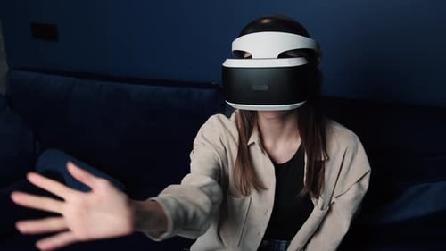 Woman Using Virtual Reality Headset at Home