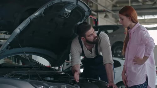 Maintenance Worker Checking Car