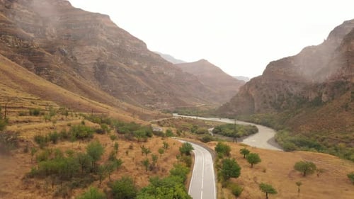 Winding Road Through Rugged Mountain Landscape