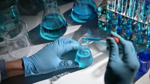 Scientist Conducts Liquid Experiment in Laboratory Setting