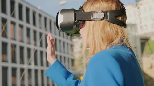 Woman Using VR Headset in an Urban Setting