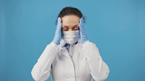 Stressed Woman in Medical Mask and Lab Coat