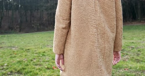 Young Happy Smilling Girl Walking on Green Lawn in the Autumn Park. Young Atractive Woman Walks and