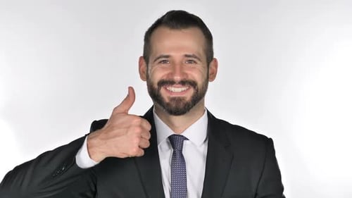 Man in Suit Gives Thumbs Up Gesture