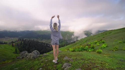 Woman Enjoying Green Mountain Vista