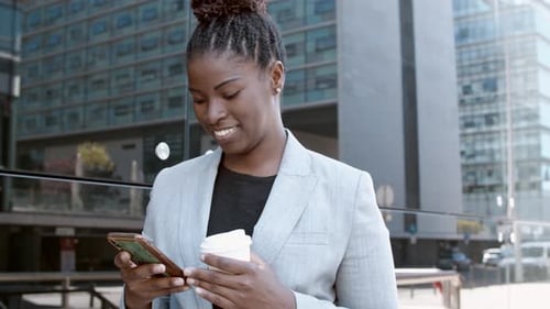 Happy Pensive Female Office Worker Standing Outside