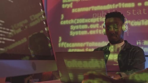 African-American Man Writing Programming Codes